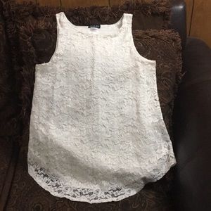 White tank top flower pattern lace over top.